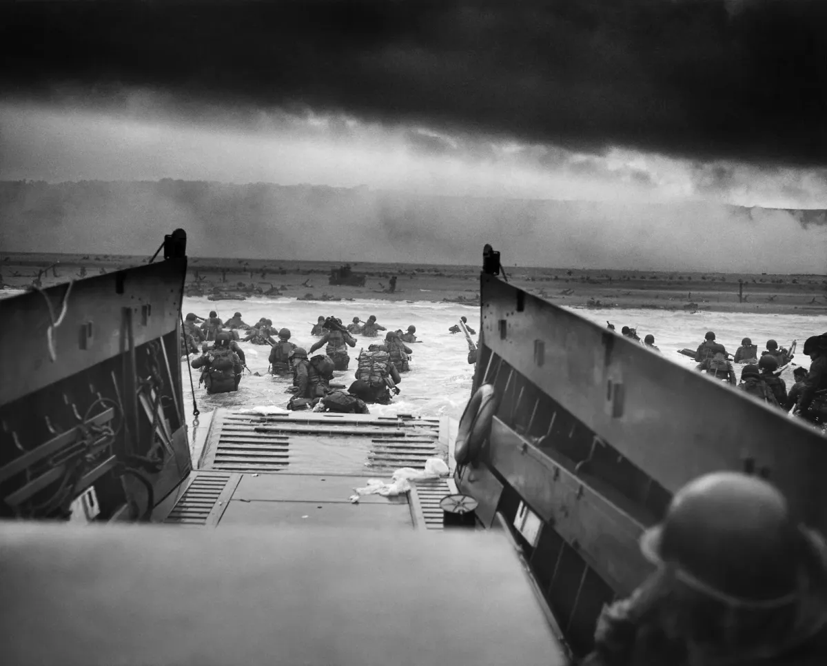 Soldiers wading ashore from a landing craft